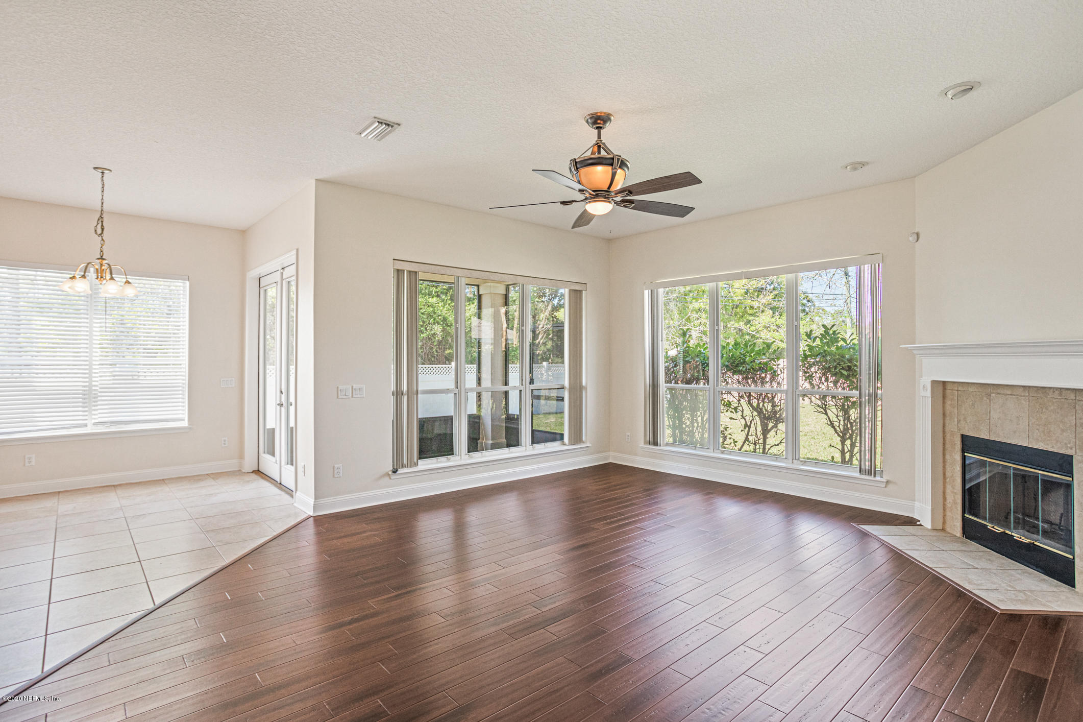 2021 Sailview Road St. Johns, FL 32259 - Photo 13 of 45 a view of an empty room with wooden floor and a window