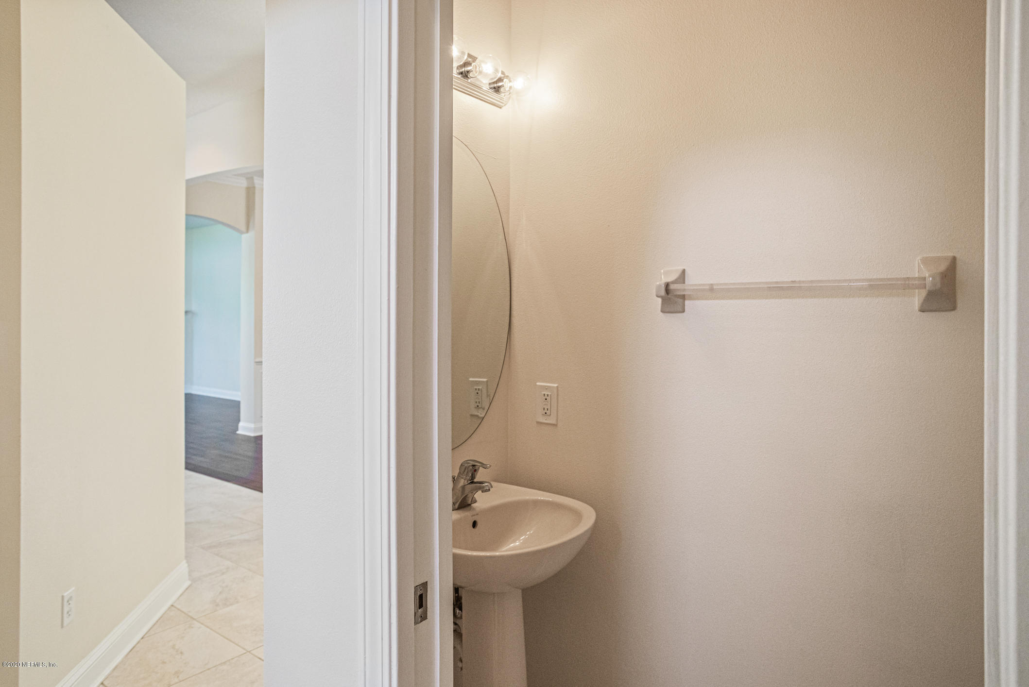 2021 Sailview Road St. Johns, FL 32259 - Photo 14 of 45 a bathroom with a sink and mirror with toilet