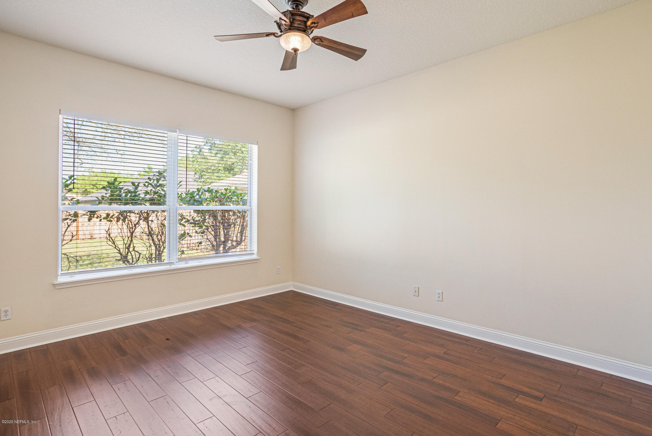 2021 Sailview Road St. Johns, FL 32259 - Photo 15 of 45 a view of an empty room with wooden floor and a window