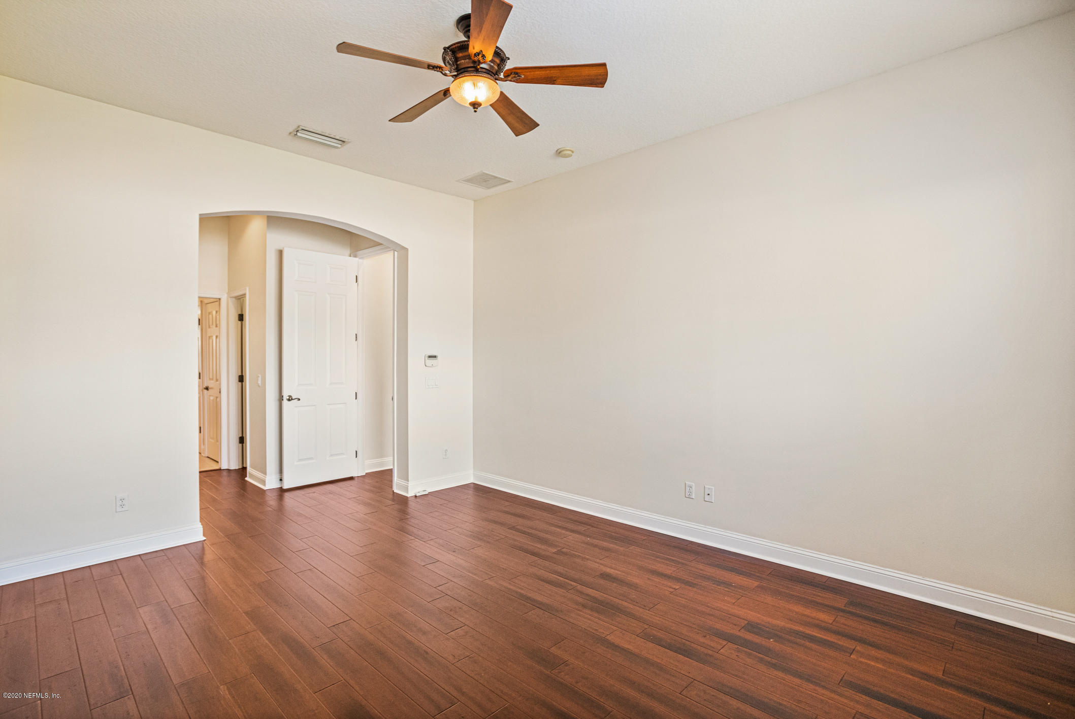 2021 Sailview Road St. Johns, FL 32259 - Photo 16 of 45 an empty room with wooden floor a ceiling fan and closet