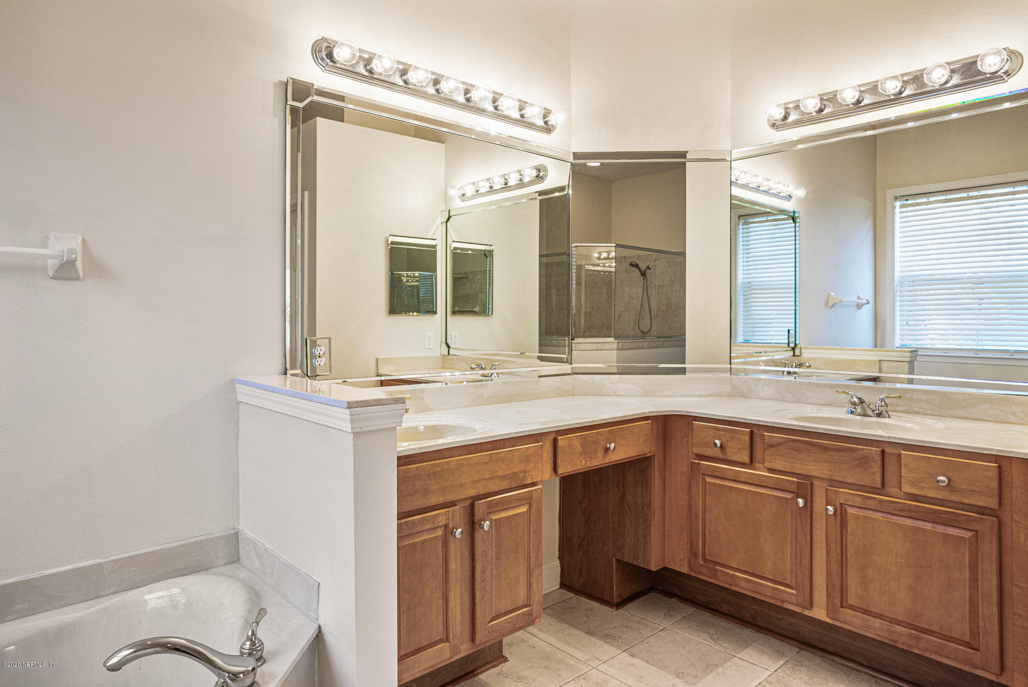 2021 Sailview Road St. Johns, FL 32259 - Photo 18 of 45 a bathroom with a granite countertop sink mirror and