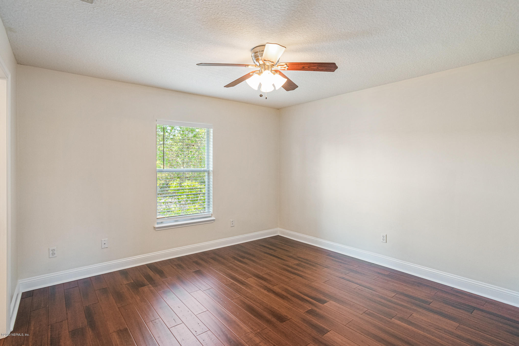 2021 Sailview Road St. Johns, FL 32259 - Photo 24 of 45 wooden floor in an empty room with a window