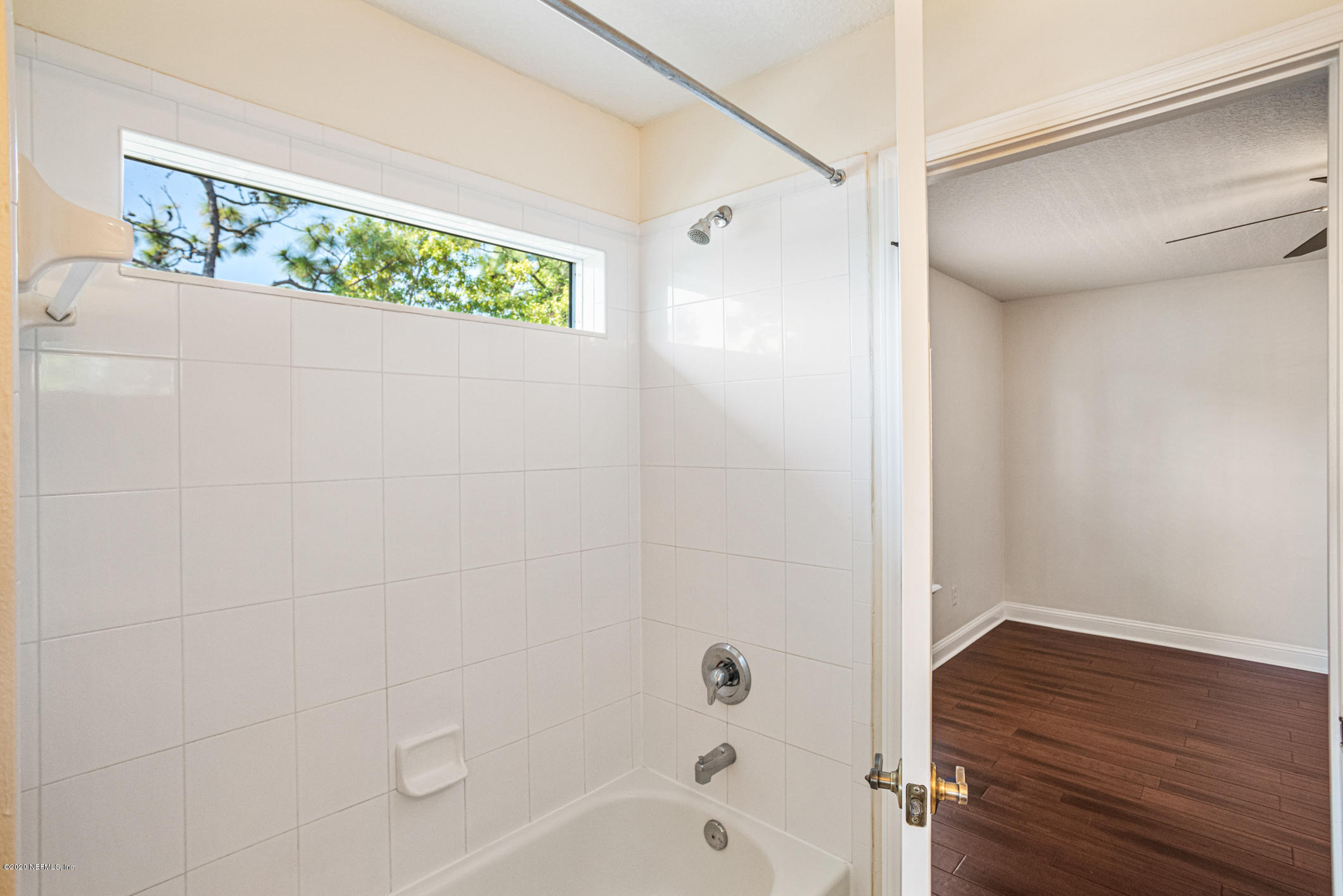 2021 Sailview Road St. Johns, FL 32259 - Photo 26 of 45 a bathroom with a bathtub and shower