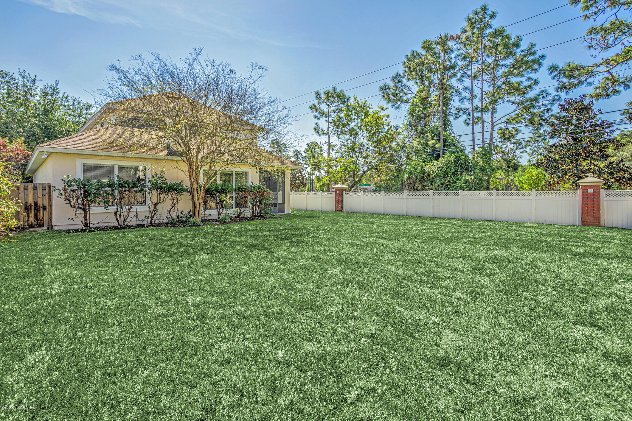 2021 Sailview Road St. Johns, FL 32259 - Photo 30 of 45 a view of a big house with a big yard and large trees