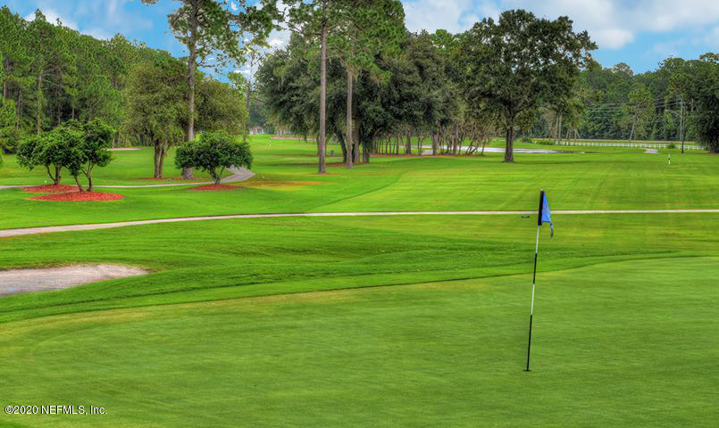 2021 Sailview Road St. Johns, FL 32259 - Photo 44 of 45 a view of grassy field with benches