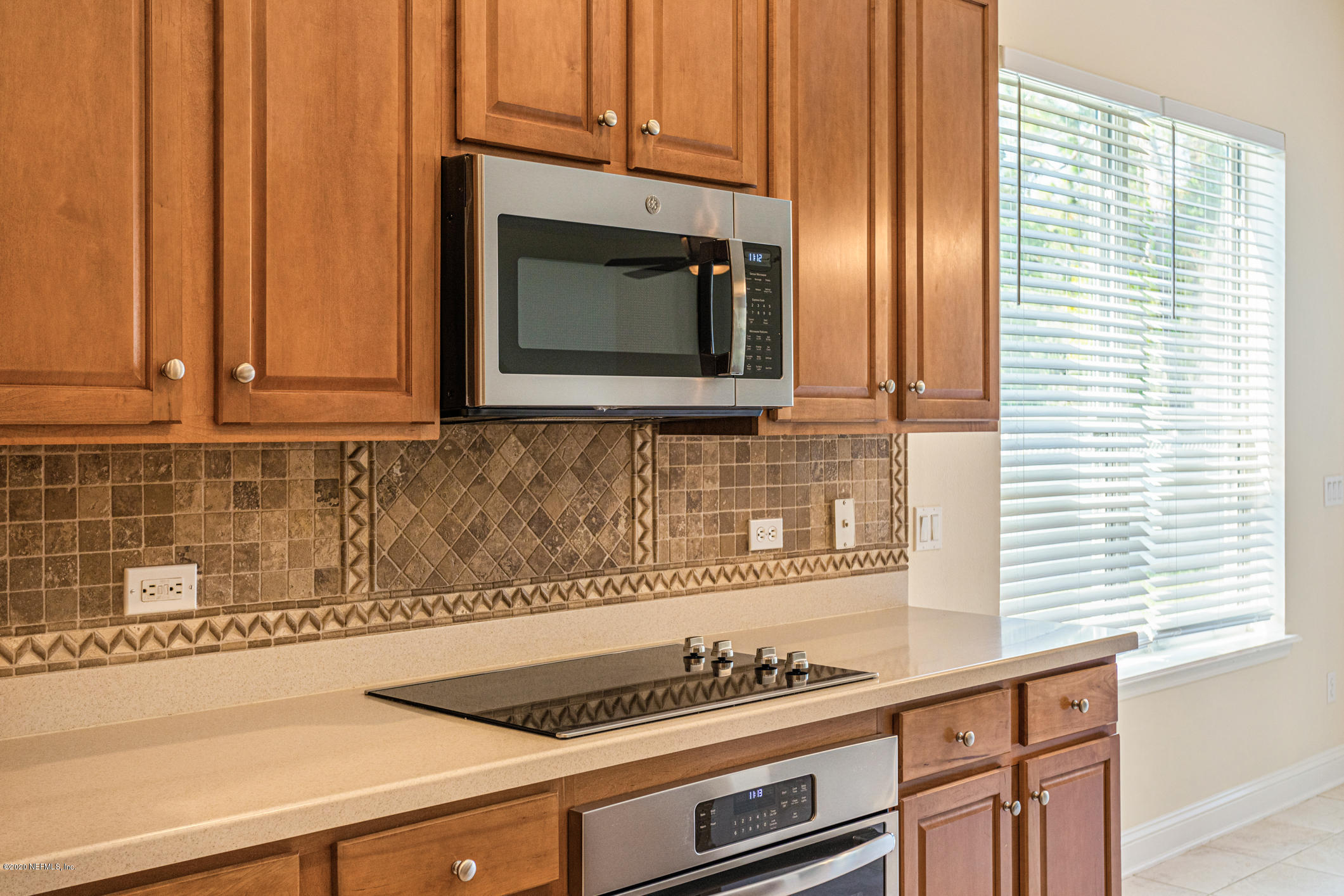 2021 Sailview Road St. Johns, FL 32259 - Photo 7 of 45 a kitchen with granite countertop cabinets stainless steel appliances and a sink