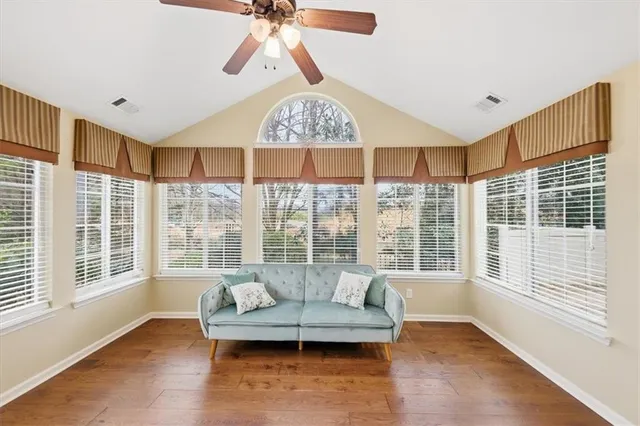 a living room with furniture and a large window