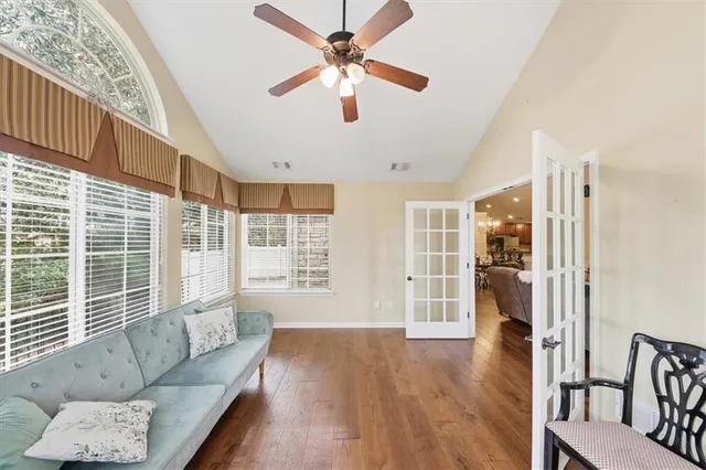 a view of a dining room with furniture and wooden floor