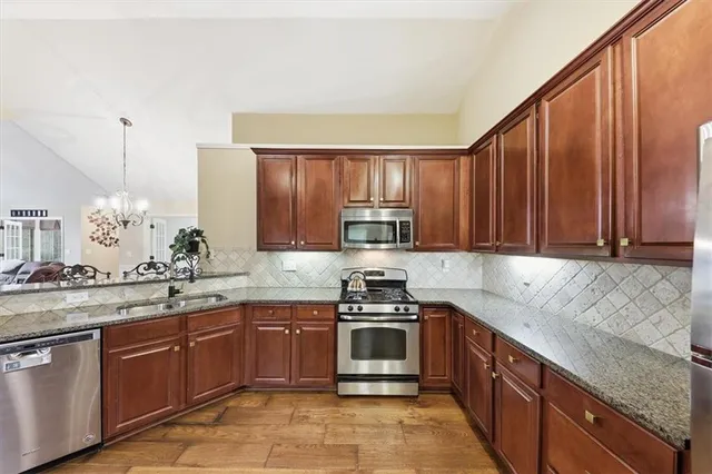 a kitchen with a sink and a refrigerator