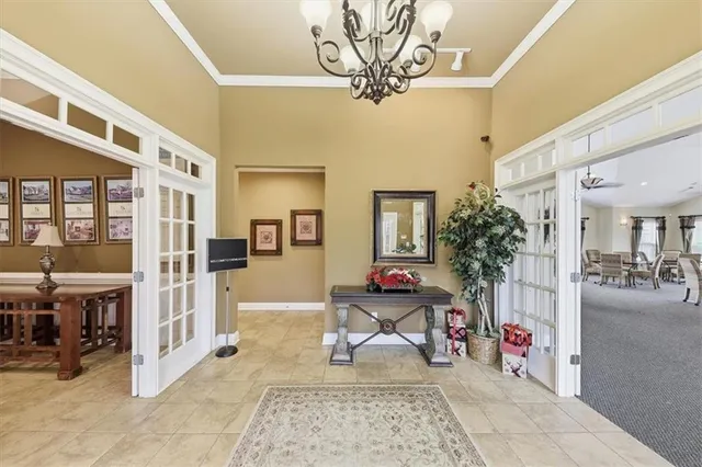 a view of a dining room with furniture and a large window