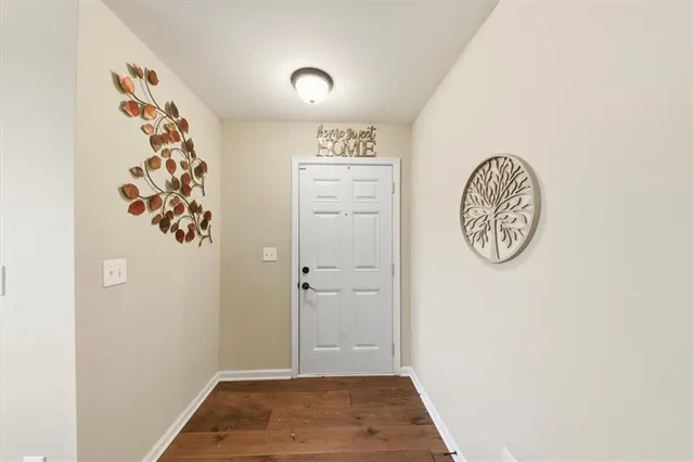 a living room with furniture a chandelier and a rug
