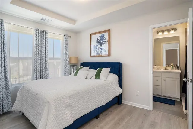 a bedroom with a bed and a dresser