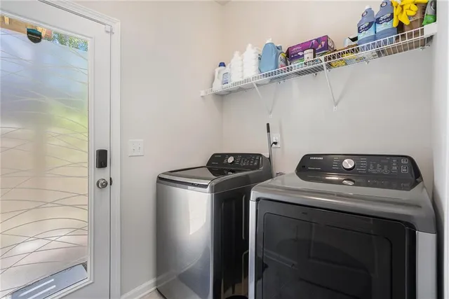 a utility room with dryer and washer