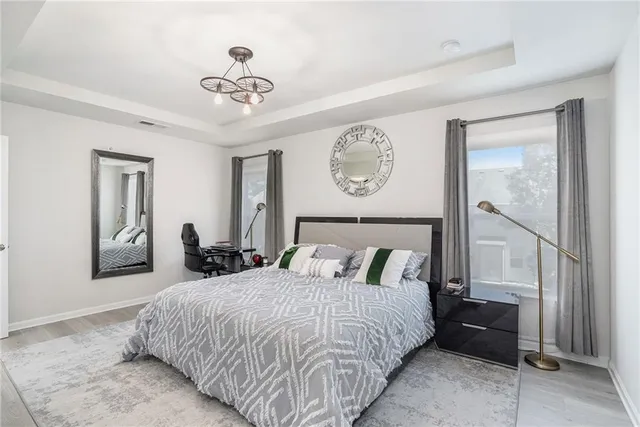 a bedroom with bed and a window