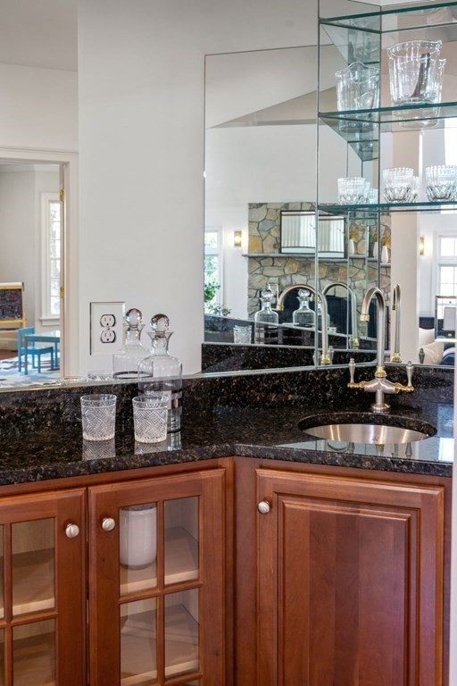 10 Forest Hill Road Wayland, MA 01778 - Photo 11 of 41 a kitchen with stainless steel appliances granite countertop a sink and wooden cabinets