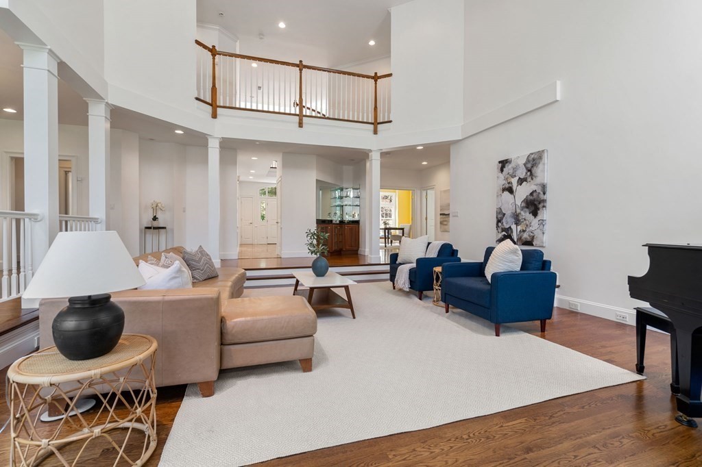 10 Forest Hill Road Wayland, MA 01778 - Photo 17 of 41 a living room with furniture and a chandelier