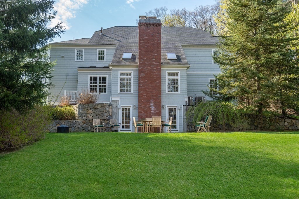 10 Forest Hill Road Wayland, MA 01778 - Photo 2 of 41 a front view of house with yard and green space