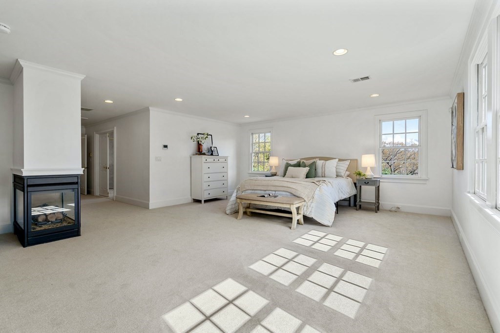10 Forest Hill Road Wayland, MA 01778 - Photo 24 of 41 a bedroom with furniture and a fireplace
