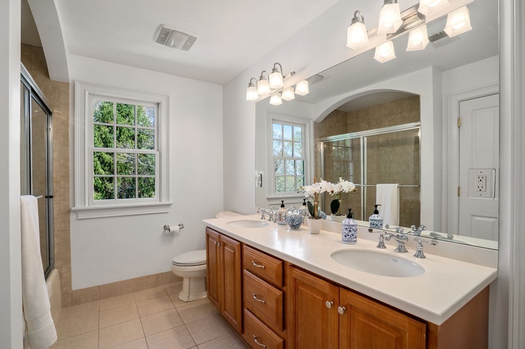 10 Forest Hill Road Wayland, MA 01778 - Photo 32 of 41 a bathroom with a sink vanity and a mirror