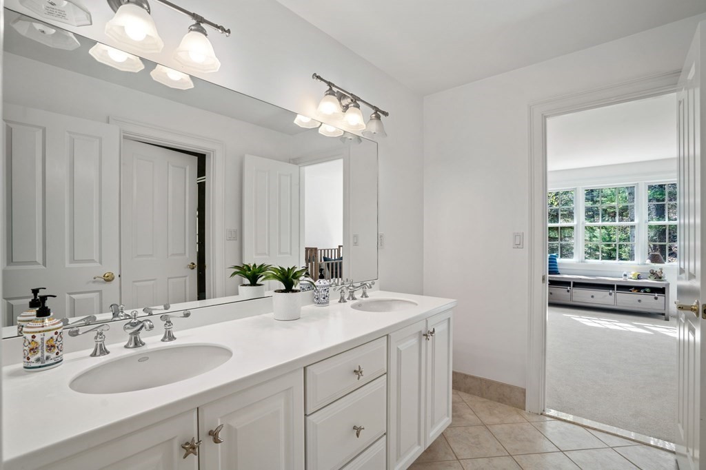 10 Forest Hill Road Wayland, MA 01778 - Photo 35 of 41 a bathroom with a sink double vanity and a mirror