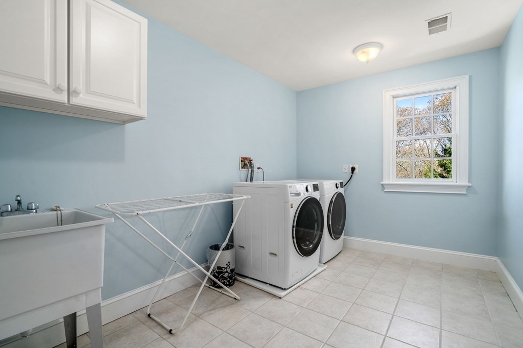 10 Forest Hill Road Wayland, MA 01778 - Photo 36 of 41 a utility room with dryer and washer