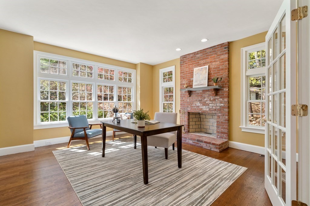 10 Forest Hill Road Wayland, MA 01778 - Photo 7 of 41 a living room with furniture a table and wooden floor