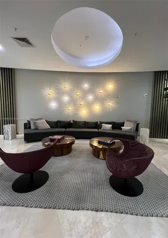 a room with furniture and a lamp