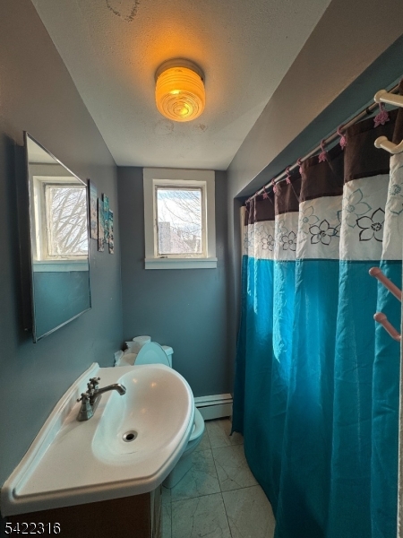 17 Cleveland Street Morristown, NJ 07960 - Photo 7 of 14 a bathroom with a sink and a mirror