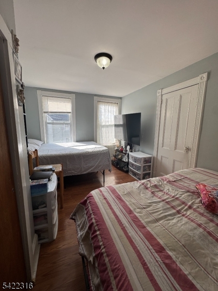 17 Cleveland Street Morristown, NJ 07960 - Photo 8 of 14 a bedroom with a bed and a flat screen tv