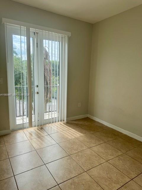 12925 Southwest 134th Terrace Miami, FL 33186 - Photo 12 of 26 a view of an empty room and window