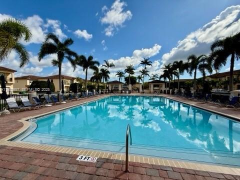12925 Southwest 134th Terrace Miami, FL 33186 - Photo 24 of 26 a view of a swimming pool with a patio