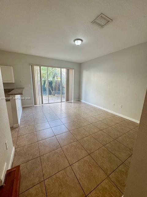 12925 Southwest 134th Terrace Miami, FL 33186 - Photo 6 of 26 a view of a livingroom with an empty space and a window