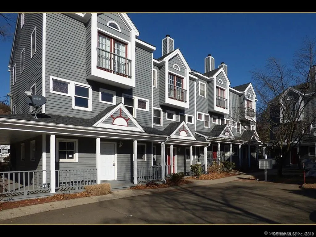 433 Blake Street, Unit 433 New Haven, CT 06515 - Photo 1 of 1 a front view of a residential apartment building with a yard