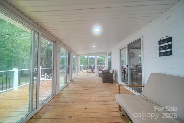 a lobby with furniture and floor to ceiling window