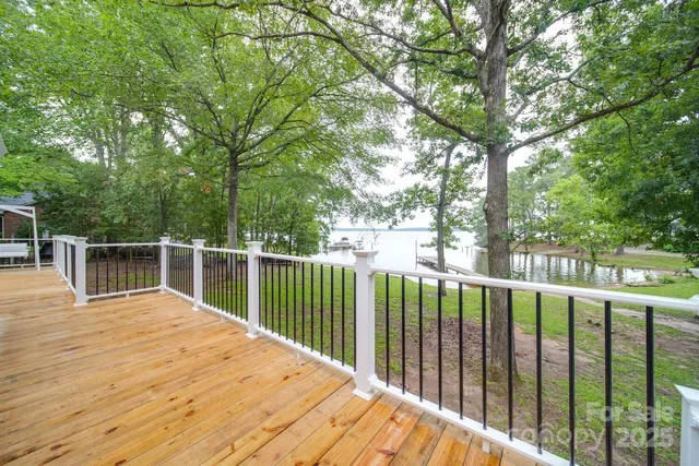 a balcony with trees in front of it