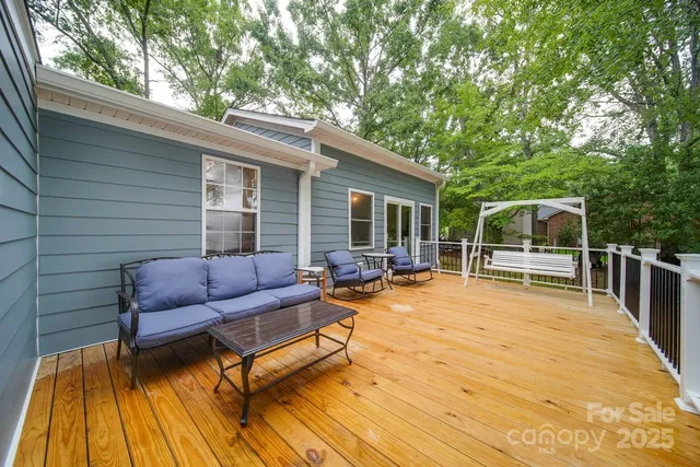 a balcony with furniture and a potted plant
