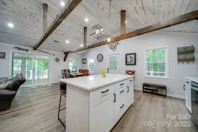 a large kitchen with a table and chairs