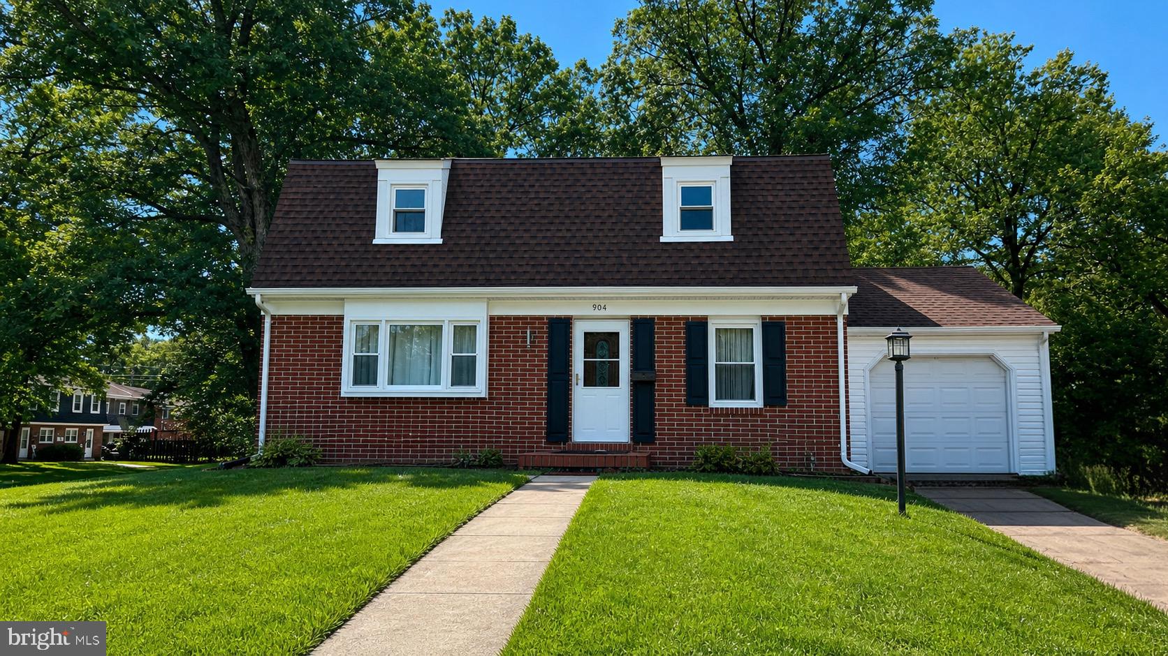 904 Averill Road Joppa, MD 21085 - Photo 1 of 39 Charming brick home with lush greenery.