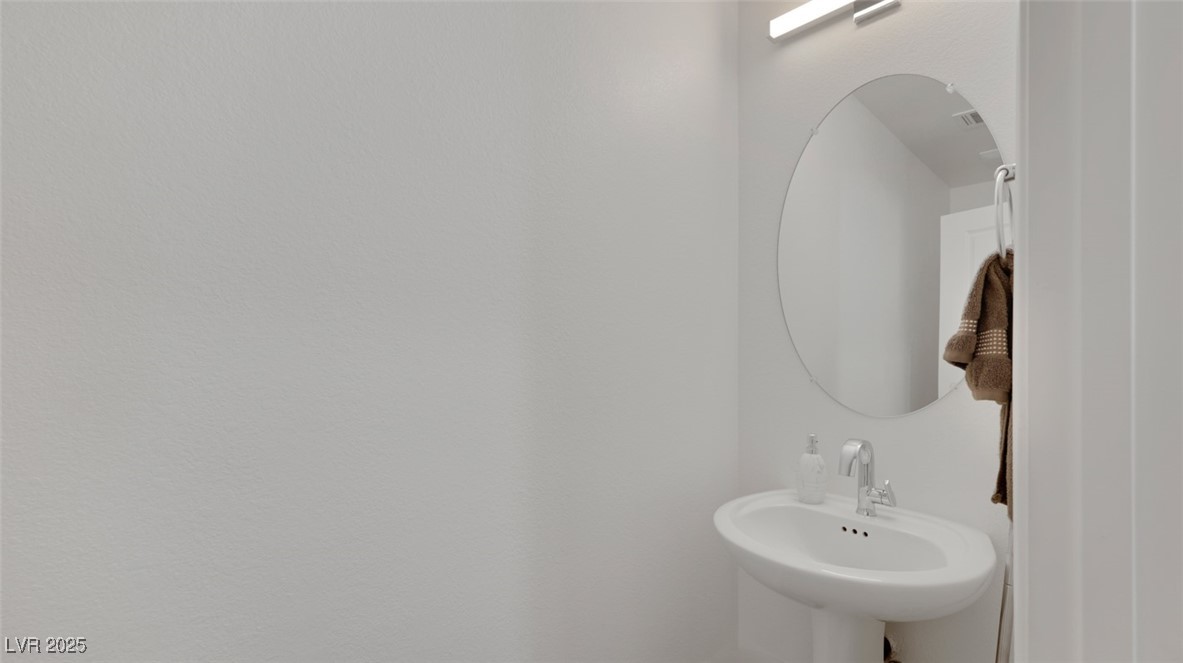 12346 Indigo Montage Road, Unit 4 Las Vegas, NV 89183 - Photo 11 of 27 Bathroom featuring a sink