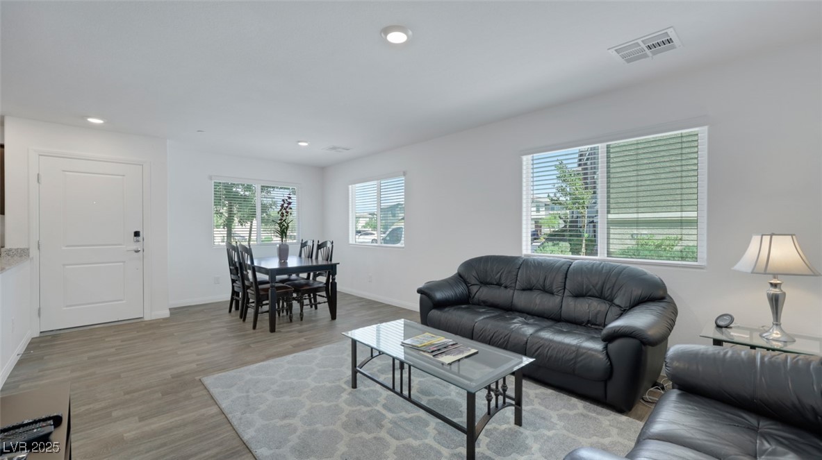 12346 Indigo Montage Road, Unit 4 Las Vegas, NV 89183 - Photo 14 of 27 Living area featuring recessed lighting and light wood-type flooring