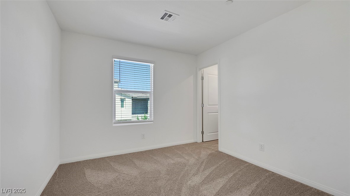 12346 Indigo Montage Road, Unit 4 Las Vegas, NV 89183 - Photo 22 of 27 Empty room with carpet floors and baseboards