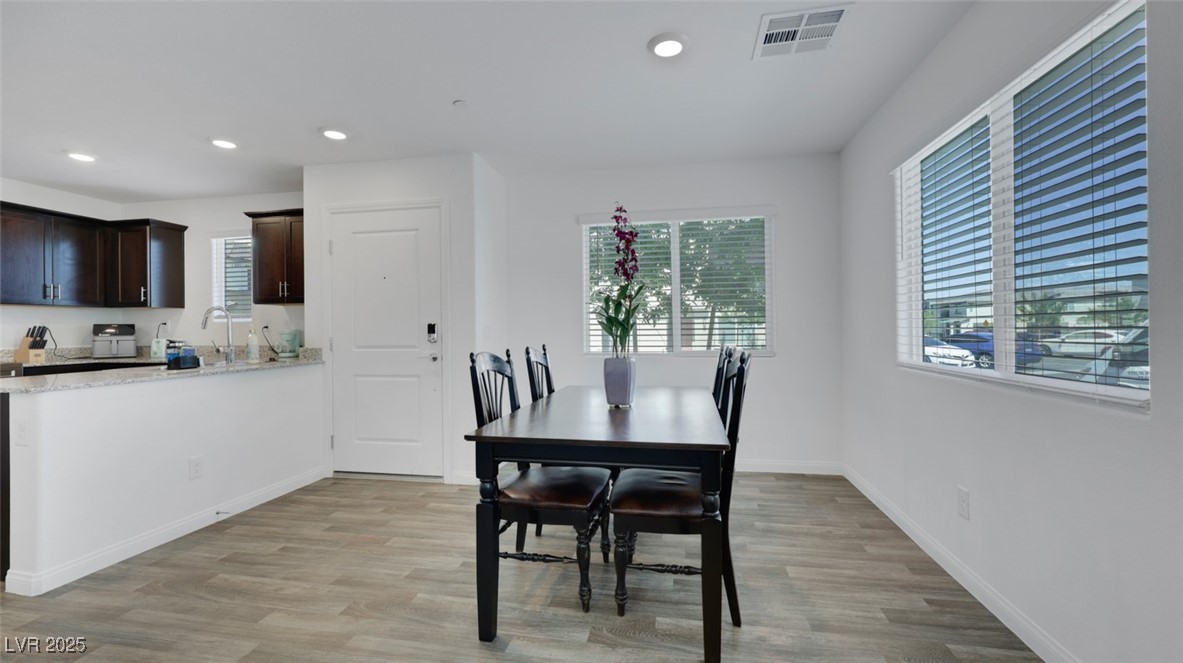 12346 Indigo Montage Road, Unit 4 Las Vegas, NV 89183 - Photo 5 of 27 Dining room featuring recessed lighting and light wood-style floors