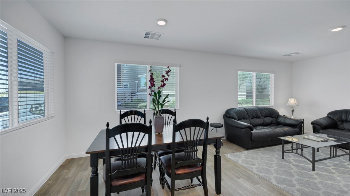 12346 Indigo Montage Road, Unit 4 Las Vegas, NV 89183 - Photo 6 of 27 Dining space featuring light wood finished floors and recessed lighting