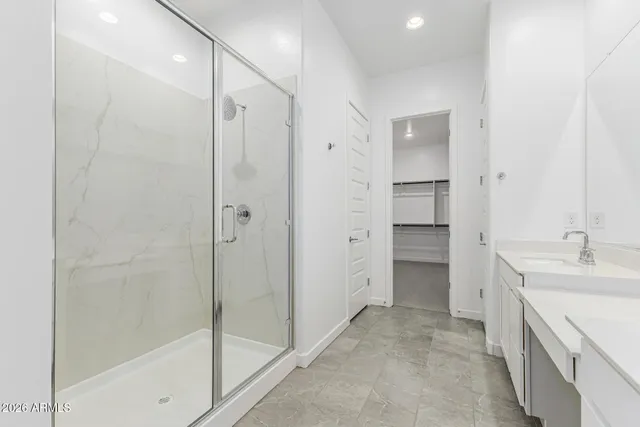 a bathroom with double sink and a mirror
