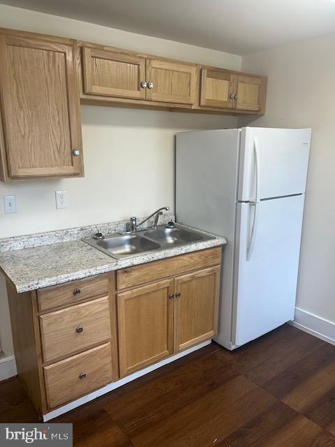 105 Cumberland Street, Unit 3 Clear Spring, MD 21722 - Photo 3 of 11 a kitchen with granite countertop a sink a stove and a refrigerator