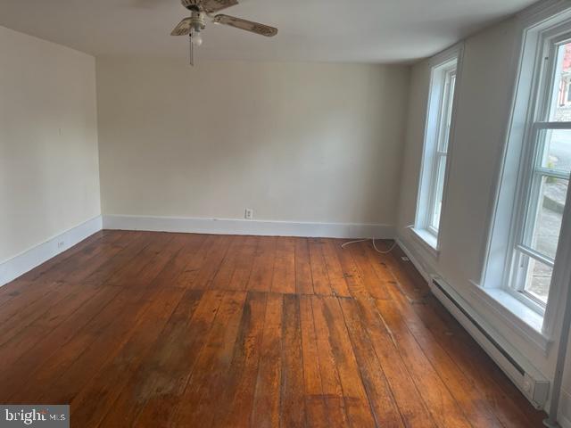 105 Cumberland Street, Unit 3 Clear Spring, MD 21722 - Photo 8 of 11 a view of room with window and wooden floor