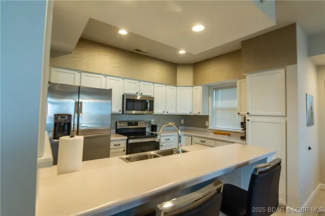 $499,000 | 62 Evergreen Condo Drive, Unit 1A, Sunrise Beach, MO 65079