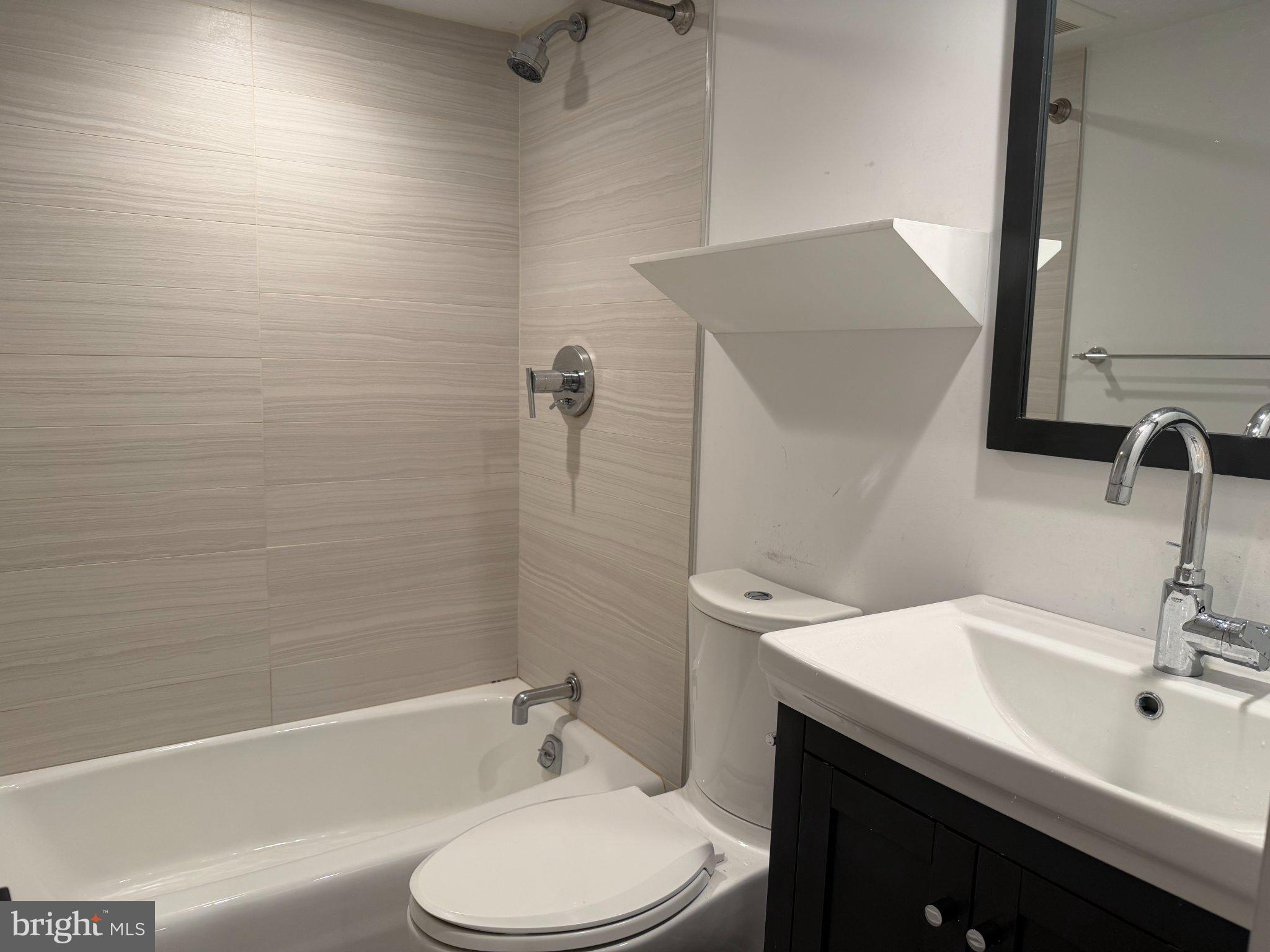 1009 Irving Street Northwest Washington, DC 20010 - Photo 30 of 33 Modern bathroom with sleek finishes.