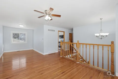 a view of a livingroom with wooden floor