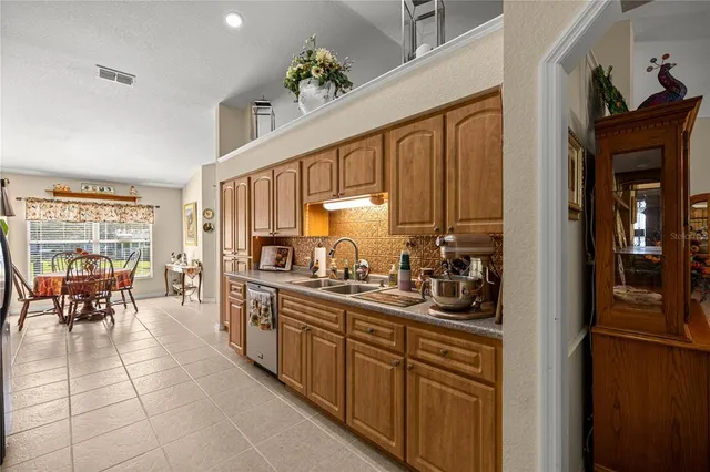 a kitchen with sink cabinets and window